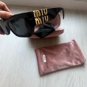 Miu Miu Black Sunglasses with Gold Accents